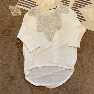 White sweater, 3/4 sleeve w/ silver design